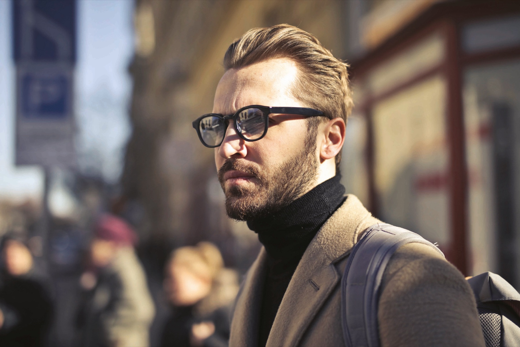 Man wearing MyAero progressive eyeglasses on a city street